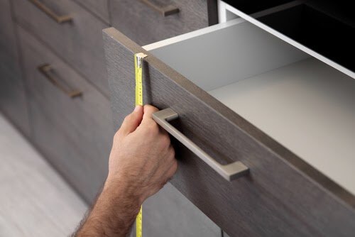 specialists measures during a kitchen renovation